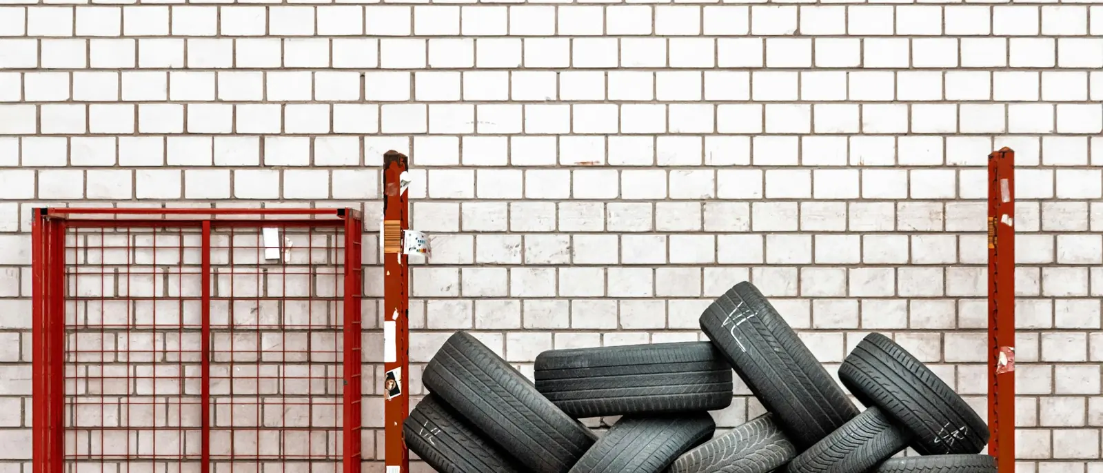 Tyres stacked on a storage rack.